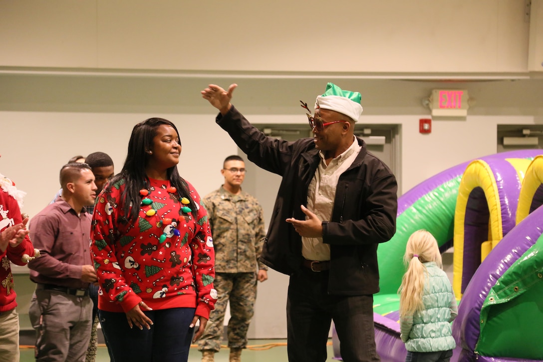 SgtMaj. Jason Patrick, SgtMaj of Marine Corps Detachment Fort Leonard Wood, judges this year's 2016 Ugly Christmas Sweater Contest at Fort Leonard Wood, MO. December 9, 2016. (U.S Marine Corps photo by Sgt. Teng Yang)