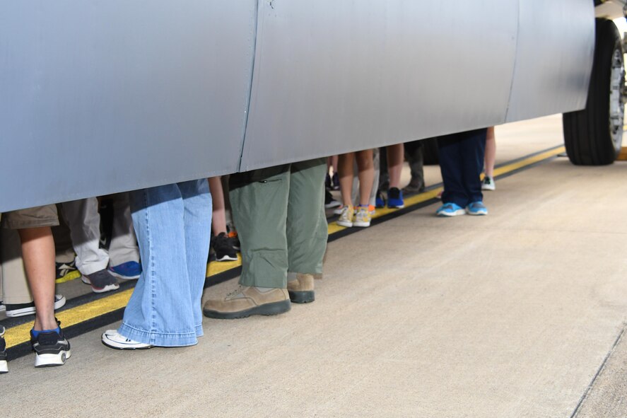 Lots of legs stick out from the bomb bay of a B-52 Stratofortress during a tour for students of STARBASE Louisiana Dec. 14, 2016 at Barksdale Air Force Base, La.   The fifth graders got to see the jet inside and out while learning about the technology and engineering that makes it the longest lasting bomber in the U.S. Air Force inventory.   STARBASE Louisiana, is a premier Department of Defense STEM (science, technology, engineering, and mathematics) program sponsored by the 307th Bomb Wing of the Air Force Reserve Command. (U.S. Air Force photo by Tech. Sgt. Ted Daigle/Released)