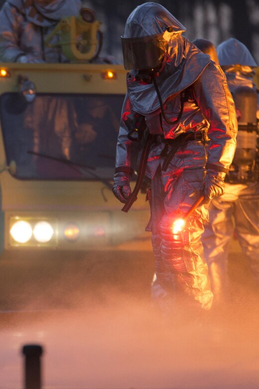 A Marine uses a flare to ignite jet fuel during a training exercise aboard Marine Corps Air Station Beaufort, Dec. 13. The Marines with Expeditionary Firefighting Rescue conducted the training to prepare for and hone skills necessary to face real life scenarios. The training also served as an opportunity to strengthen camaradarie and enhance trust among the unit members. The Marines are with EFR, Headquarters and Headquarters Squadron.