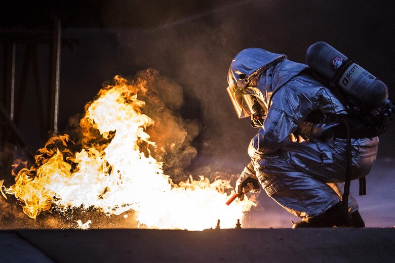 A Marine ignites jet fuel with a flare during a training exercise aboard Marine Corps Air Station Beaufort, Dec. 13. The Marines with Expeditionary Firefighting Rescue conducted the training to prepare for and hone skills necessary to face real life scenarios. The training also
served as an opportunity to strengthen camaradarie and enhance trust among the unit members. The Marines are with EFR, Headquarters and Headquarters Squadron.