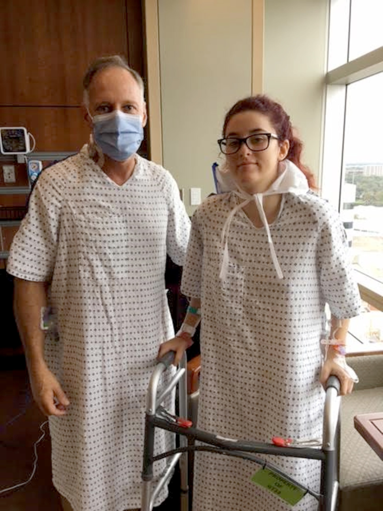 Elissa White, 19, stands with her father, Retired Master Sgt. Derrell White, after the two had surgery so Elissa could donate a kidney to her dad December 7, 2016 at Florida Hospital, Orlando. Derrell White had been suffering with a low functioning kidney due to a chronic condition. The Family was opposed to their daughter being a donor at first, but after running out of options, they accepted her gift of a kidney. (Courtesy photo)