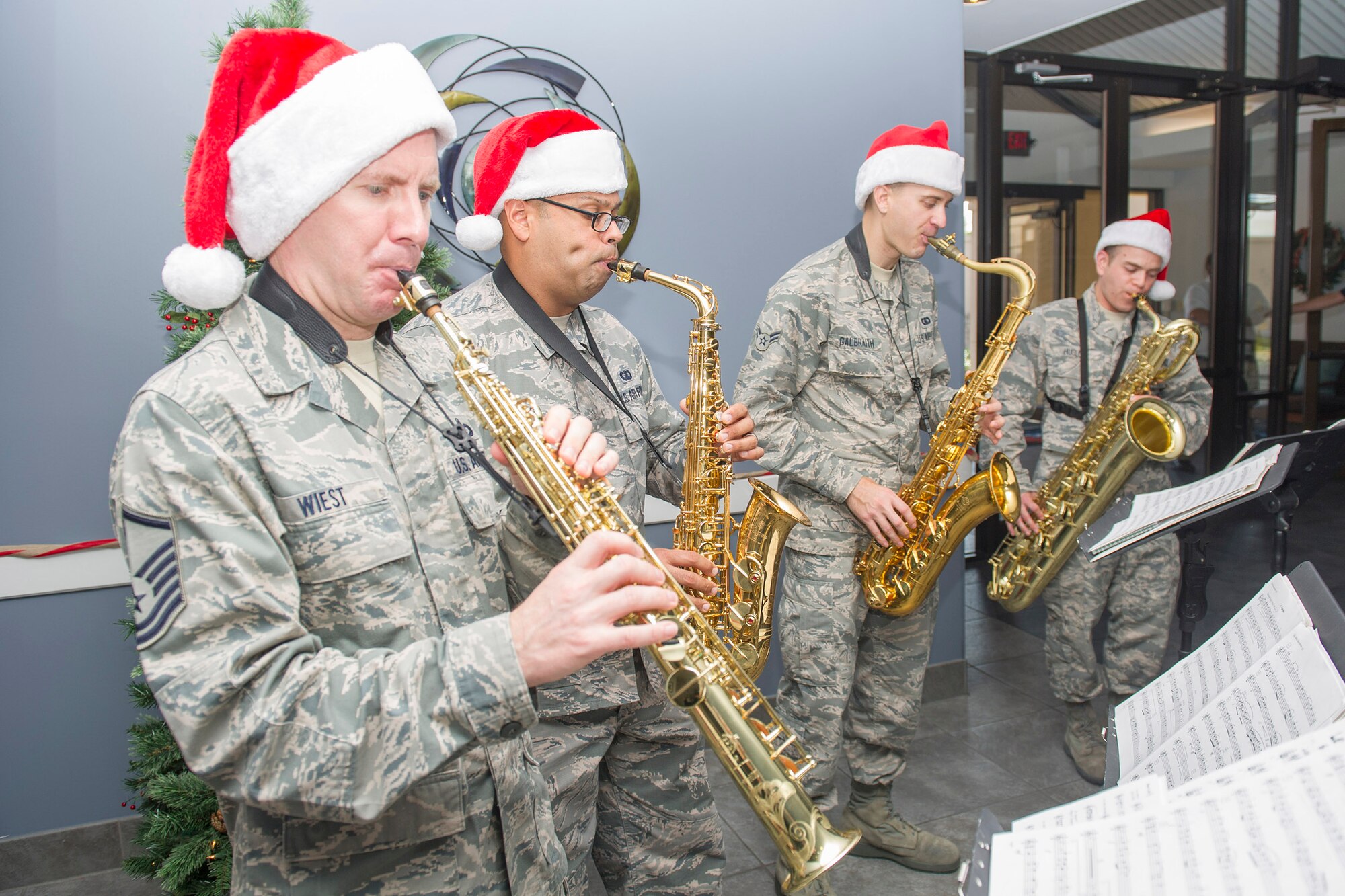 Members of the Air Force Band of the West saxophone quartet visited here to showcase their holiday music Dec. 14, 2016, at Patrick Air Force Base and Cape Canaveral Air Force Station, Fla. The band performed at the Fire Station, Morrell Operations Center, food court, Shark Tank, lodging, Child Development Center, Riverside Dining Facility, Base Exchange, and Commissary. (U.S. Air Force photo/Matthew Jurgens)