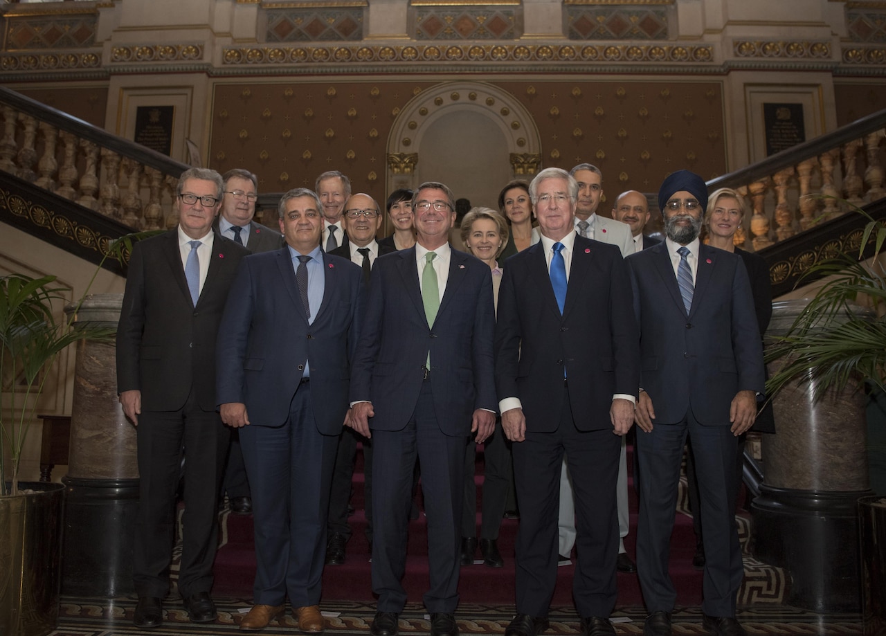 Defense Secretary Ash Carter poses for a group photo with fellow defense secretaries and ministers of defense in London during a meeting of defense ministers whose countries are participating in the campaign to counter the Islamic State of Iraq and the Levant, Dec. 15, 2016. DoD photo by Air Force Tech. Sgt. Brigitte N. Brantley
