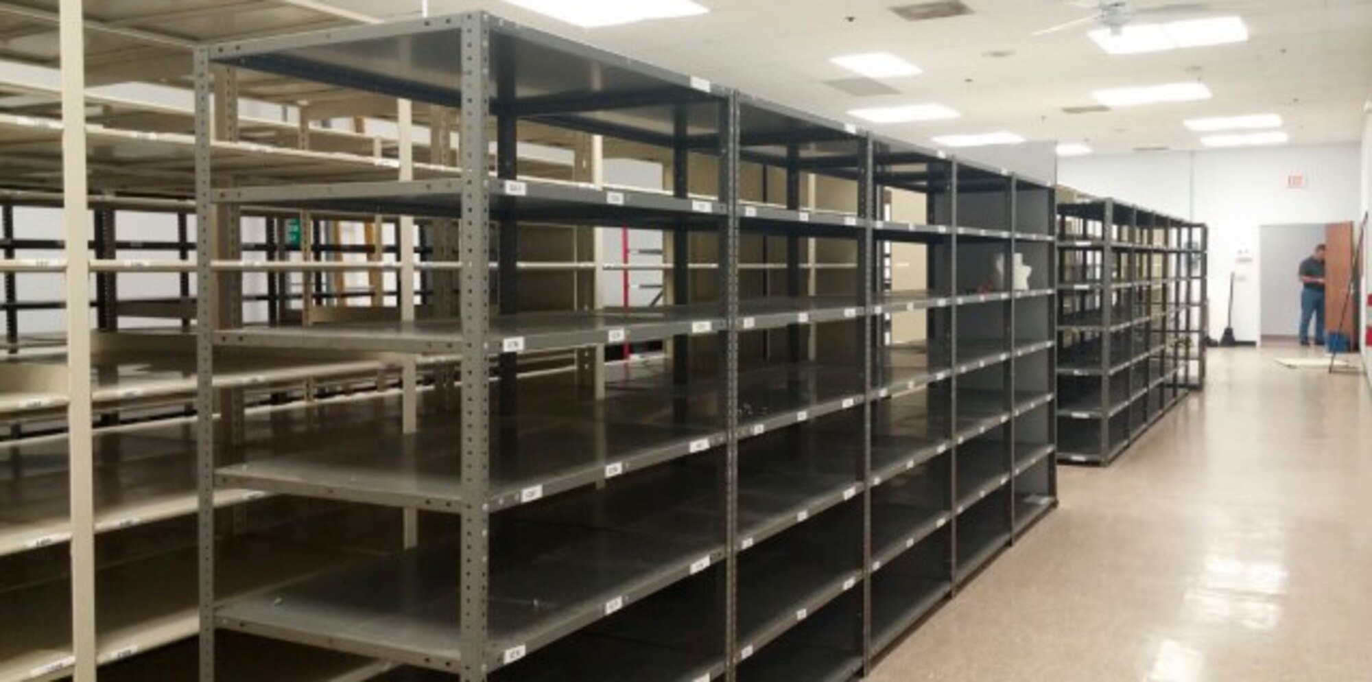 Storage shelves stand empty in a staging area at MacDill Air Force Base, Fla., Oct. 3, 2016. The wing records managers digitized their 1,700 square foot staging area over the past two years, freeing up the necessary storage to house future accountability of equipment received. (Courtesy Photo)