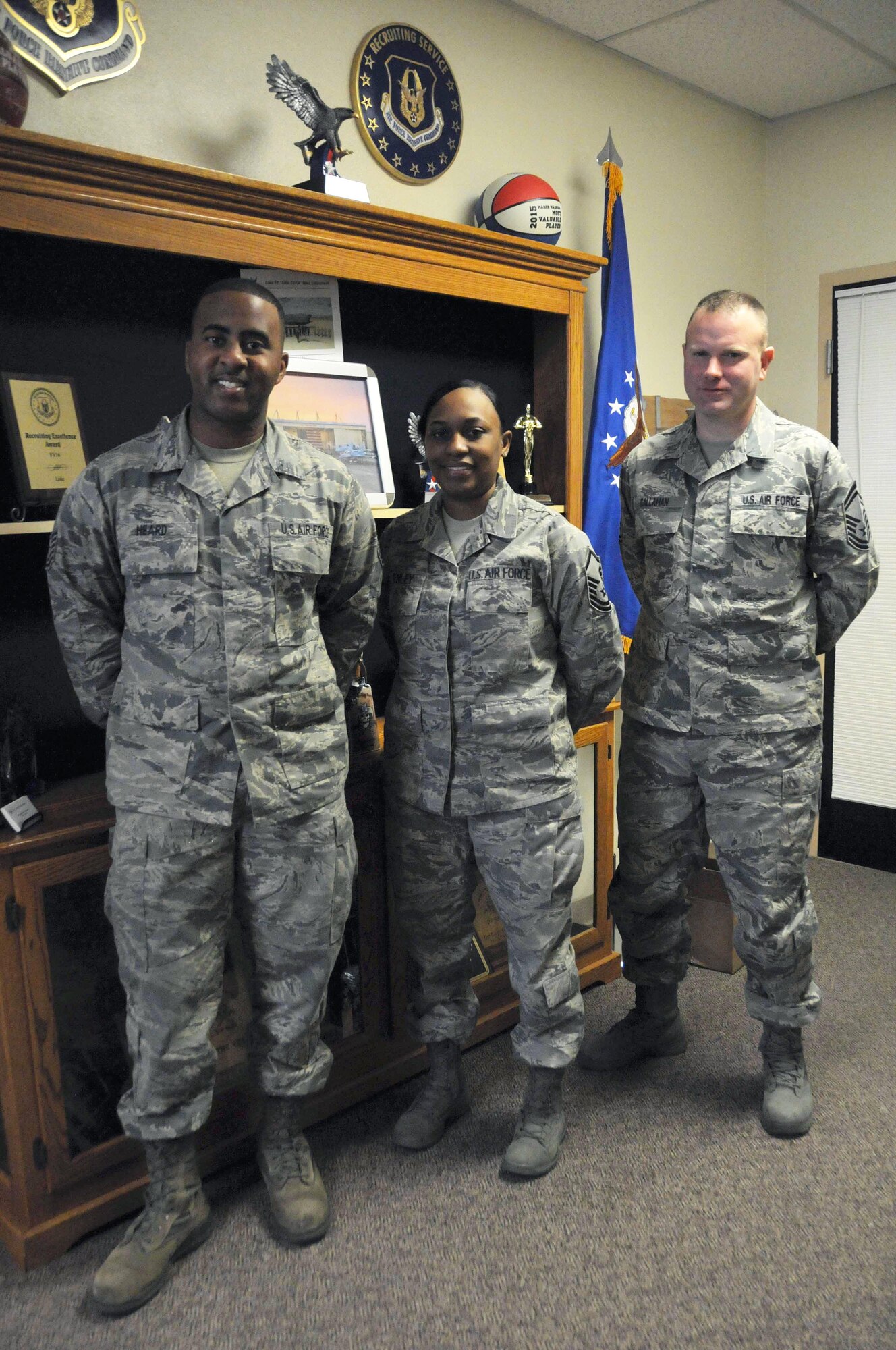 Tech. Sgt. Marquise Heard, Master Sgt. Ricketa Conley, 944th Fighter Wing recruiters, and Senior Master Sgt. Clayton Callahan, 944 FW recruiting flight chief, pose for a photo Dec. 3 at Luke Air Force Base, Arizona. (U.S. Air Force photo by Staff Sgt. Lauren Snyder)