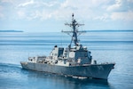 In this file photo, The Arleigh Burke-class guided-missile destroyer USS Mustin (DDG 89) steams during the Cooperation Afloat Readiness and Training (CARAT) Cambodia 2014 exercise. In its 20th year, CARAT is a series of bilateral naval exercises between the U.S. Navy, U.S. Marine Corps and the armed forces of nine partner nations in South and Southeast Asia. 