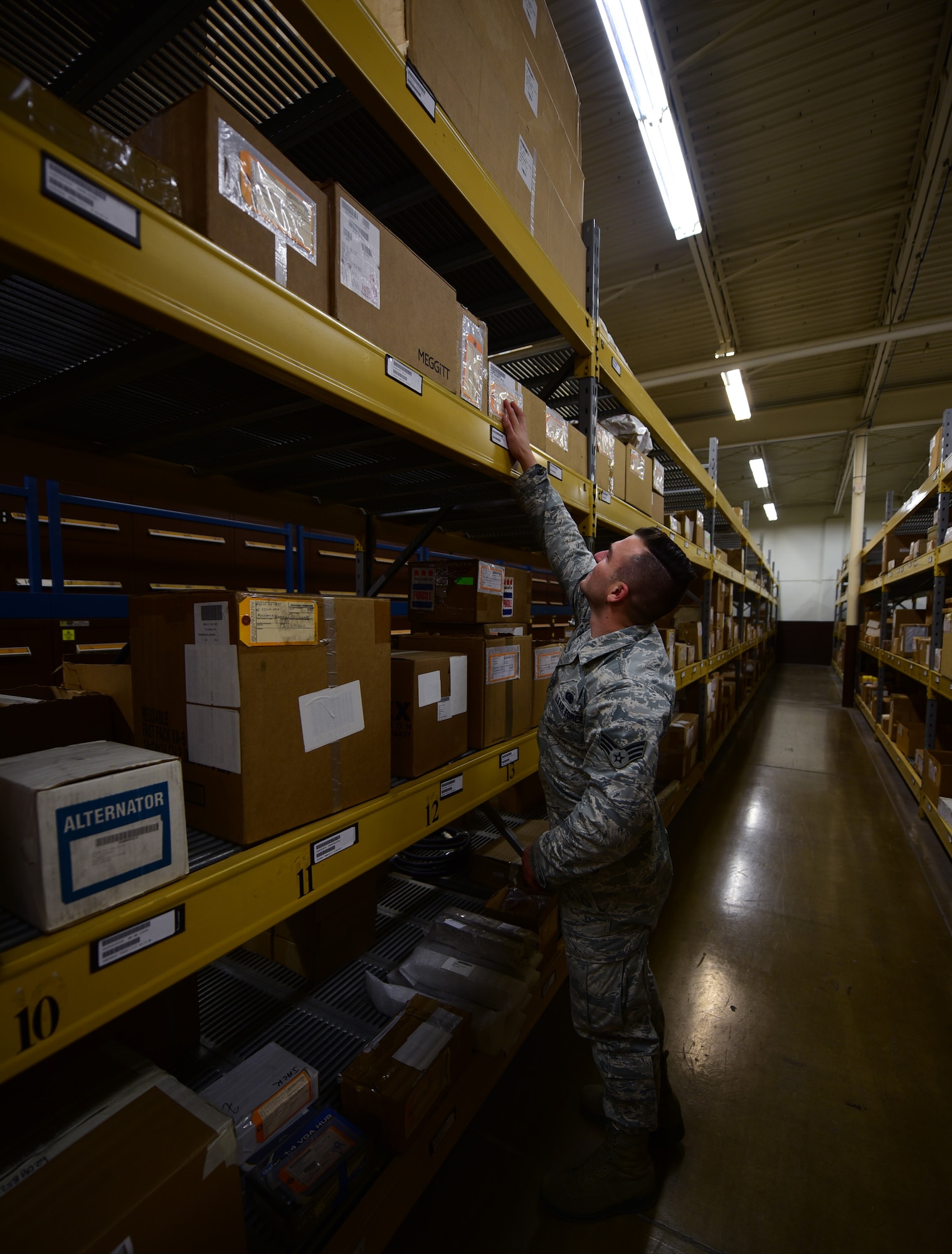 Senior Airman Bradley Weaver, a central storage technician assigned to the 28th Logistics Readiness Squadron, looks for a part at Ellsworth Air Force Base S.D., Dec. 6, 2016. Weaver and other Central Storage technicians maintain more than 18,000 assets worth more than $80 million. (U.S. Air Force photo by Airman 1st Class James L. Miller) 