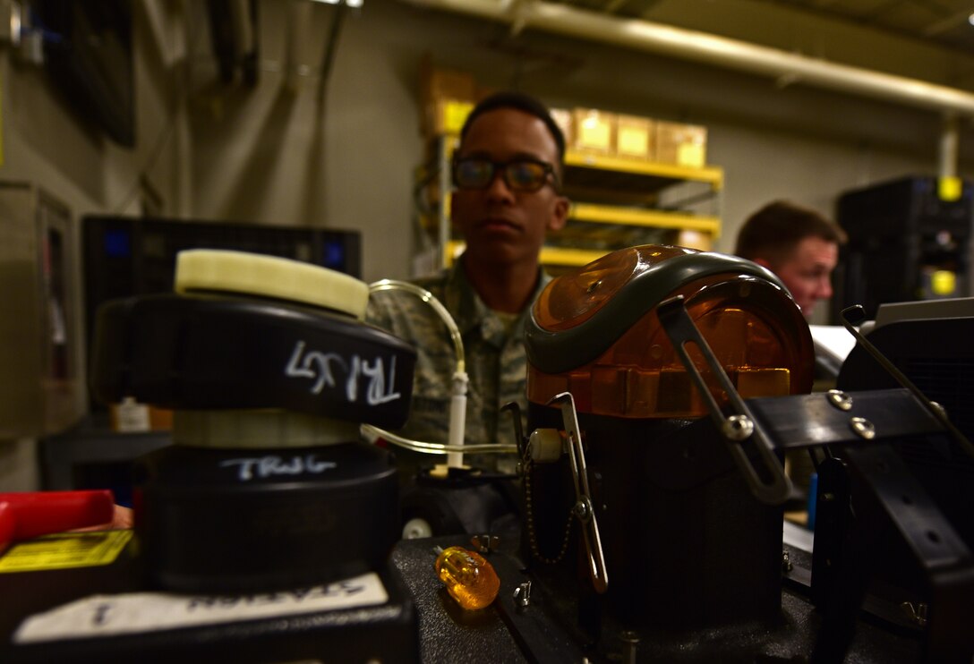 Airman 1st Class Justin Stoney, an Individual Protective Equipment technician assigned to the 28th Logistics Readiness Squadron, tests the seal of a gas mask at Ellsworth Air Force Base S.D., Dec. 6, 2016. Stoney is responsible for maintaining gas masks, which includes sanitizing them when they are turned in, testing them before they are issued and inspecting them periodically to ensure their readiness. (U.S. Air Force photo by Airman 1st Class James L. Miller)