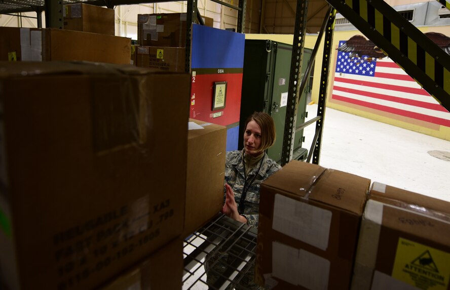 Airman 1st Class Rebecca Nunez, an Aircraft Parts Store technician assigned to the 28th Logistics Readiness Squadron, organizes storage shelves in the aircraft parts store at Ellsworth Air Force Base S.D., Dec. 7, 2016. The Aircraft Parts Store remains stocked and organized at all times, which results in parts requests being handled in as little as 15 minutes. (U.S. Air Force photo by Airman 1st Class James L. Miller) 