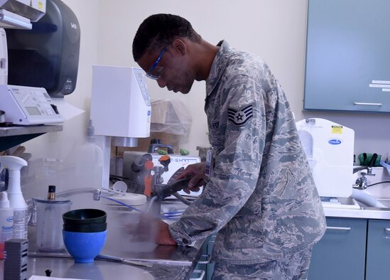 Staff Sgt. Khodie Morgan, 341st Medical Operations Squadron dental laboratory technician, steam cleans a gold crown in the dental laboratory Dec. 5, 2016, at Malmstrom Air Force Base, Mont. The final process of creating a gold crown includes cleaning and polishing the compounds with the steamer. (U.S. Air Force photo/Senior Airman Jaeda Tookes)

