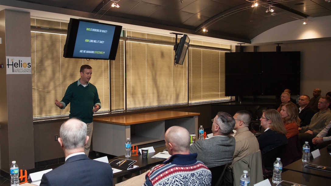 Master Sgt. Conor Mahoney, a team member of the Marine Corps Intelligence, Surveillance, and Reconnaissance Enterprise Accelerator Program, showcases new technology developed during the program at Stafford, Virginia, Dec. 9. Helios, the technology developed during the program, is designed to keep request for intelligence (RFI) customers informed throughout the production process. The demonstration is the culmination of 12 weeks of design and development for Helios.