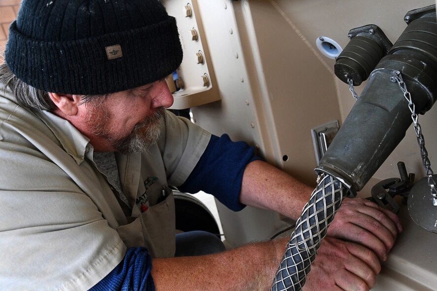 Michael, an aerospace ground equipment mechanic with the 432nd Wing/432nd Air Expeditionary Wing, performs maintenance on the ground control station Dec. 5, 2016, at Creech Air Force Base, Nev. AGE mechanics maintain mission critical equipment such as air conditioning units and generators that support the GCS. (U.S. Air Force photo by Airman 1st Class James Thompson)