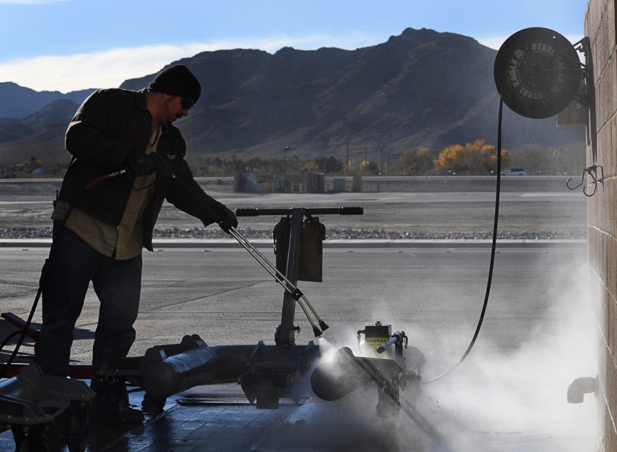 Robert, an aerospace ground equipment mechanic with the 432nd Wing/432nd Air Expeditionary Wing, washes an MQ-9 Reaper landing gear jack Dec. 6, 2016, at Creech Air Force Base, Nev. The jack is one of approximately 100 pieces of AGE that he and his coworker are responsible for. (U.S. Air Force photo by Airman 1st Class James Thompson) 
