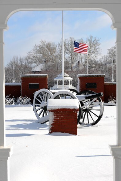 The flag was at half-staff on the Offutt AFB parade ground as the snow began to fall in December 2012. Don't get caught unprepared for the frigid weather this winter, take precautions to ensure success if you ever get caught out in the cold. (U.S. Air Force photo by Josh Plueger)