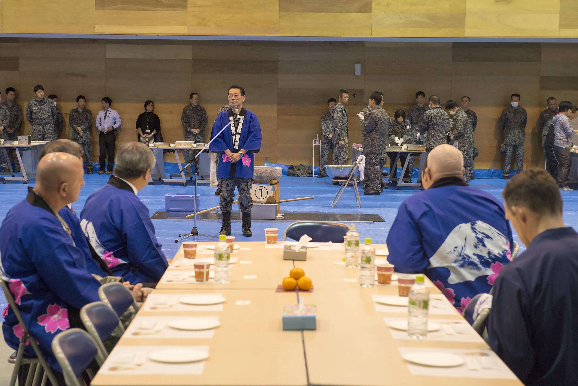 Japan Air Self-Defense Force Col. Shuichi Kamada, Operation Support Wing commander, gives opening remarks during a traditional Japanese event at Yokota Air Base, Japan, Dec. 14, 2016. Base leadership, local civic leaders and members of the JASDF pounded rice before eating the mochi together. (U.S. Air Force photo by Senior Airman David C. Danford/Released)