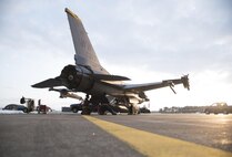 U.S. Air Force Airman 1st Class Eric Chung, left, a crew chief, and Staff Sgt. Esteban Ramirez, right, an engines technician, both with the 14th Aircraft Maintenance Unit, perform maintenance underneath an F-16 Fighting Falcon at Misawa Air Base, Japan, Dec. 12, 2016. Several shops from the 35th Aircraft Maintenance Squadron work with each other to perform their specialized craft on the aircraft. Airmen performed maintenance through engine panels in an F-16, allowing personnel to troubleshoot an engine without removing it. (U.S. Air Force photo by Airman 1st Class Sadie Colbert)