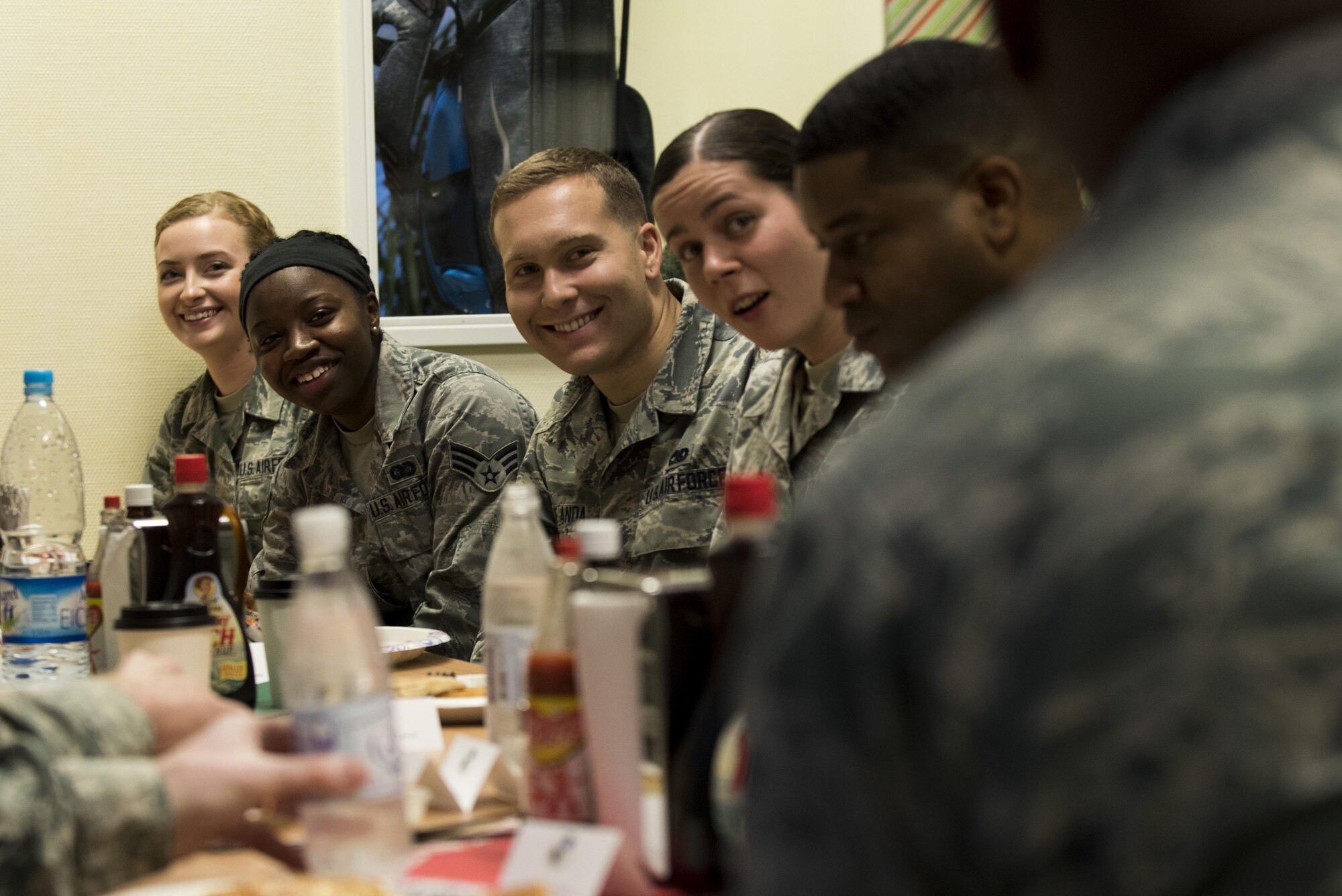 Airmen assigned to the 52nd Fighter Wing have breakfast with U.S. Air Force Lt. Gen. Richard Clark, 3rd Air Force
and 17th Expeditionary Air Force commander, right, and Chief Master Sgt. Phillip L. Easton, 3rd Air Force and 17th
Expeditionary Air Force command chief, center right, during a base familiarization tour at Spangdahlem Air Base, Dec. 14, 2016. Clark talked to the wing about his three main priorities: the importance of mission, inspiring Airmen and making time for family. (U.S. Air Force photo by Airman 1st Class Preston Cherry)