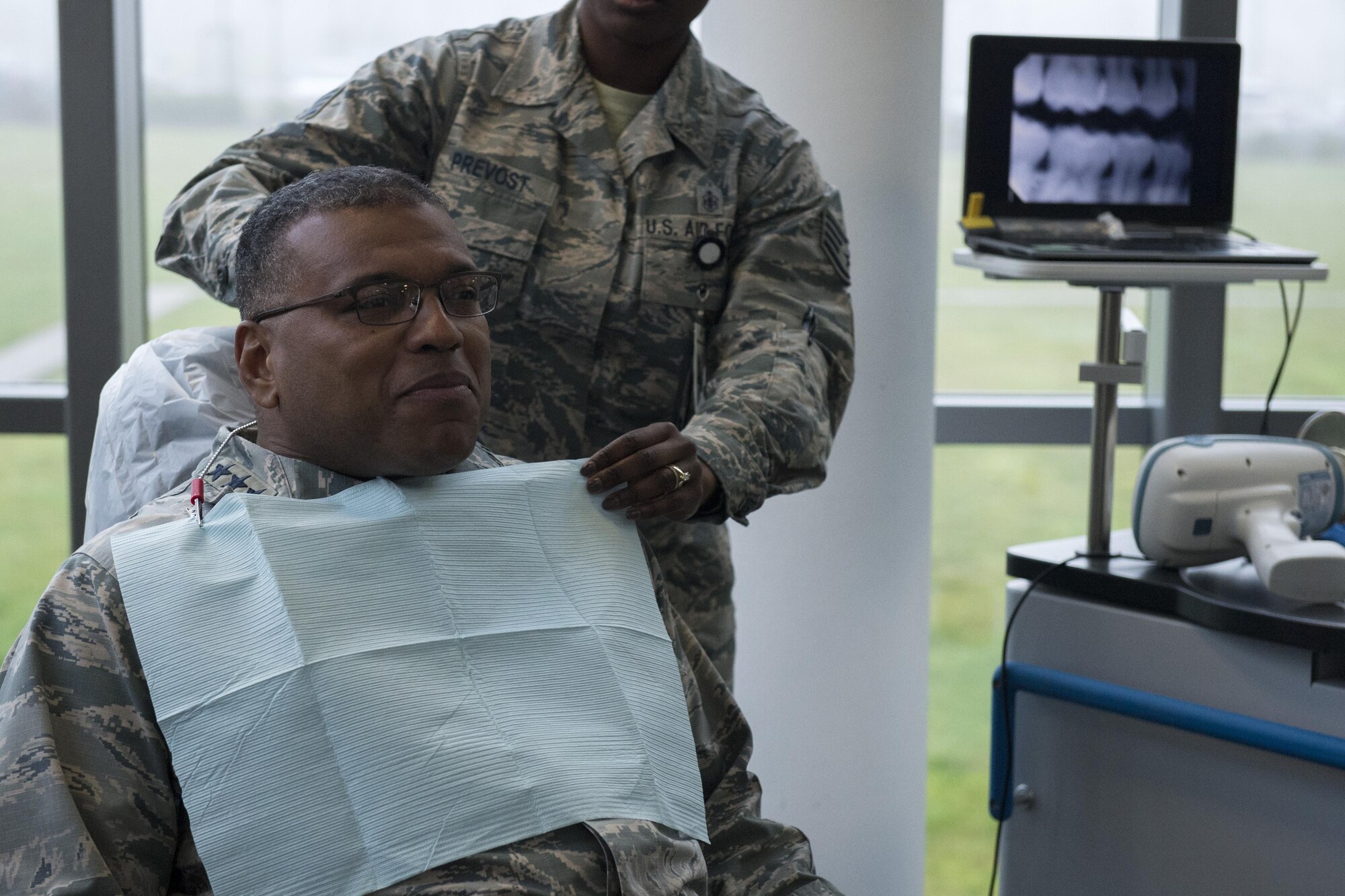 U.S. Air Force Lt. Gen. Richard Clark, 3rd Air Force and 17th Expeditionary Air Force commander, listens to a 52nd Dental Squadron briefing during a base familiarization tour at the base clinic on Spangdahlem Air Base, Dec. 14, 2016. Clark learned many various other squadrons’ missions as part
of his first visit to Spangdahlem since assuming command in October 2016. (U.S. Air Force photo by Airman 1st Class Preston Cherry)