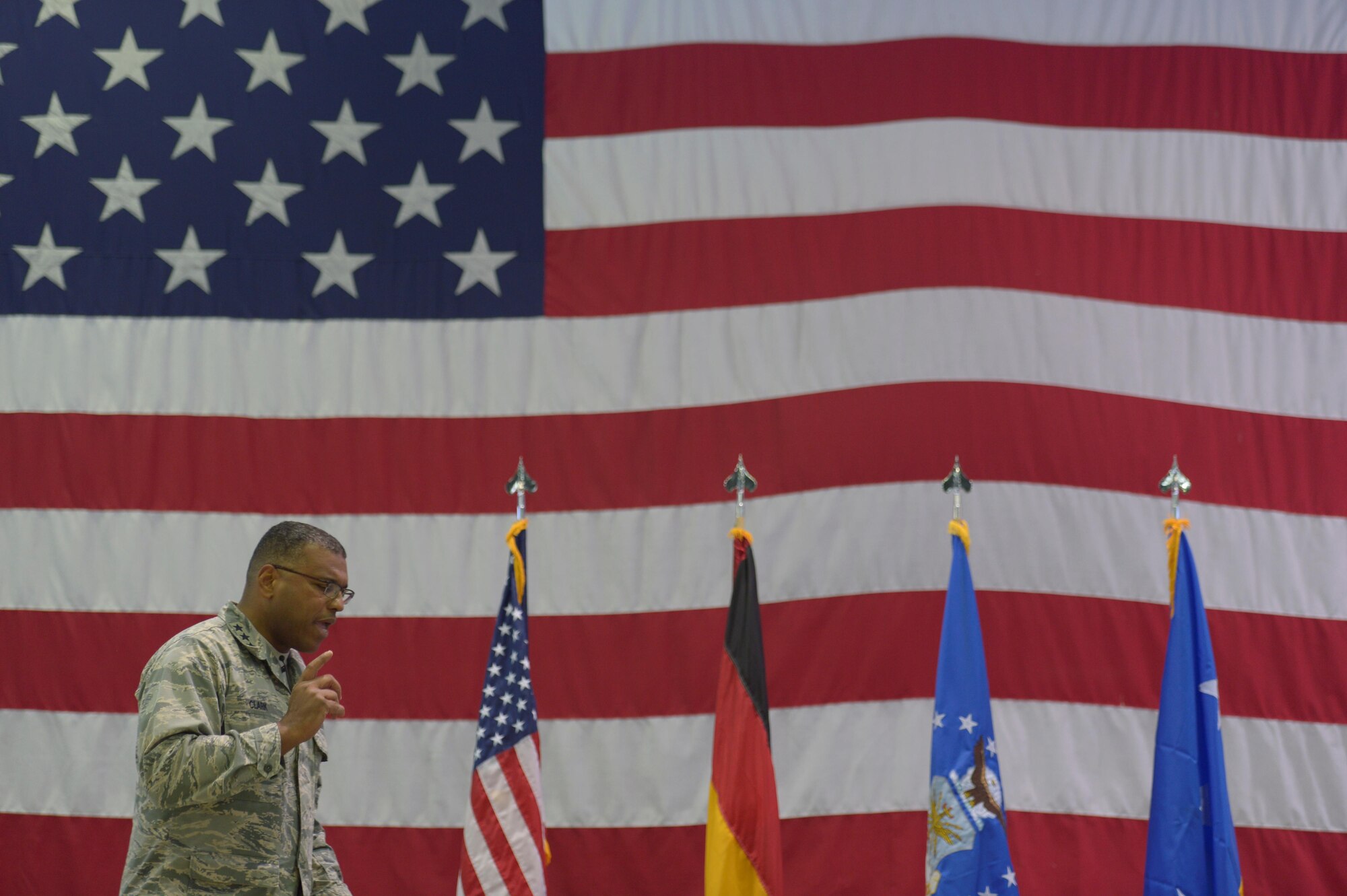 Lt. Gen. Richard Clark, 3rd Air Force and 17th Expeditionary Air Force commander, talks about his priorities during an all call at Hangar One on Spangdahlem Air Base, Germany, Dec. 14, 2016. This visit represented his first time at Spangdahlem Air Base since assuming command in October 2016. (U.S. Air Force photo by Staff Sgt. Jonathan Snyder)