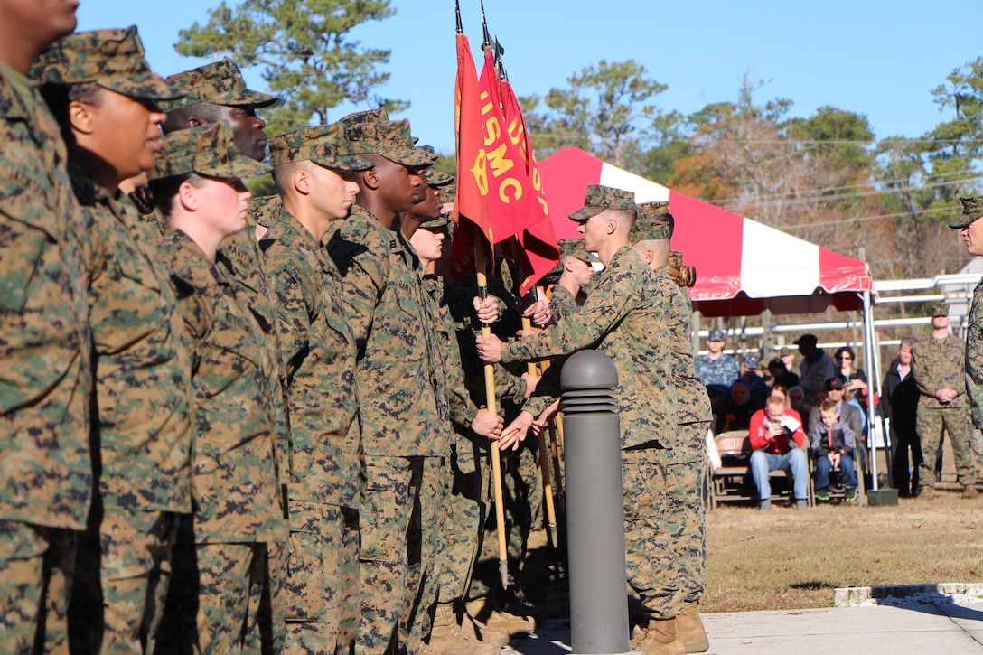 After 8 weeks of intense mental and physical training, the platoon leadership of Class 17010 returns the platoon guidons to their instructors at the FMTB-E graduation ceremony.