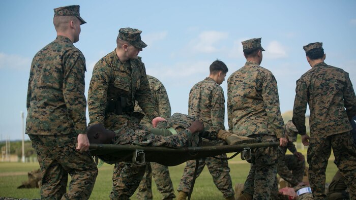 Marines with Camp Hansen Provost Marshal’s Office and camp guard carry a role player Dec. 12 during Exercise Constant Vigilance 2016 at Camp Hansen, Okinawa, Japan. Constant Vigilance is an annual exercise that sharpens MCIPAC emergency response skills on bases across Okinawa through rehearsals and drills in varying scenarios. During the casualty evacuation, Marines with Camp Hansen Marines cleared a mock collapsed building and removed simulated casualties. Upon removing the personnel inside the building, the Marines assessed casualties’ medical needs and escorted them to the landing zone to transport them out of the area to receive advanced medical care.