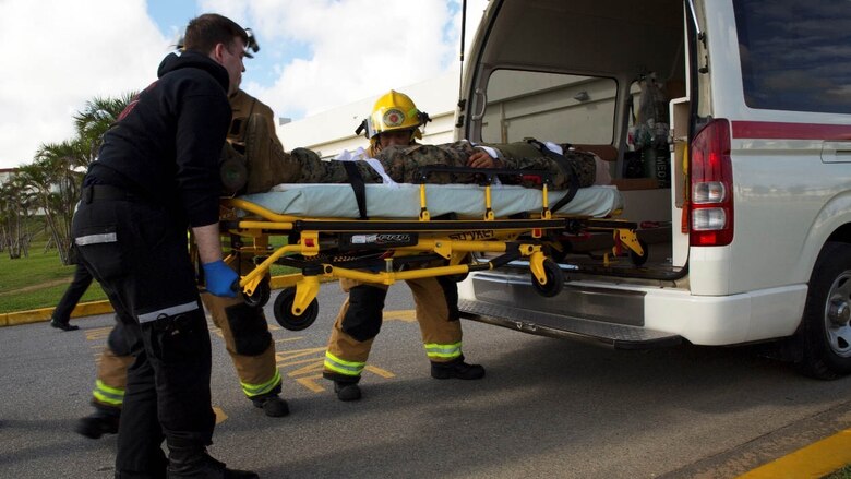 Marine Corps Installations Pacific Fire Department members participate in a casualty evacuation drill Dec. 13 during Exercise Constant Vigilance 2016 at Camp Schwab, Okinawa, Japan. Constant Vigilance is an annual exercise that sharpens MCIPAC emergency response skills on bases across Okinawa through rehearsals and drills in varying scenarios. During the casualty evacuation, Marines with Camp Schwab Camp Guard and the Provost Marshal’s Office cleared a collapsed building and removed simulated casualties. Upon removing the personnel inside the building, the Marines assessed casualties’ medical needs and escorted them to the landing zone to transport them out of the area to receive advanced medical care.