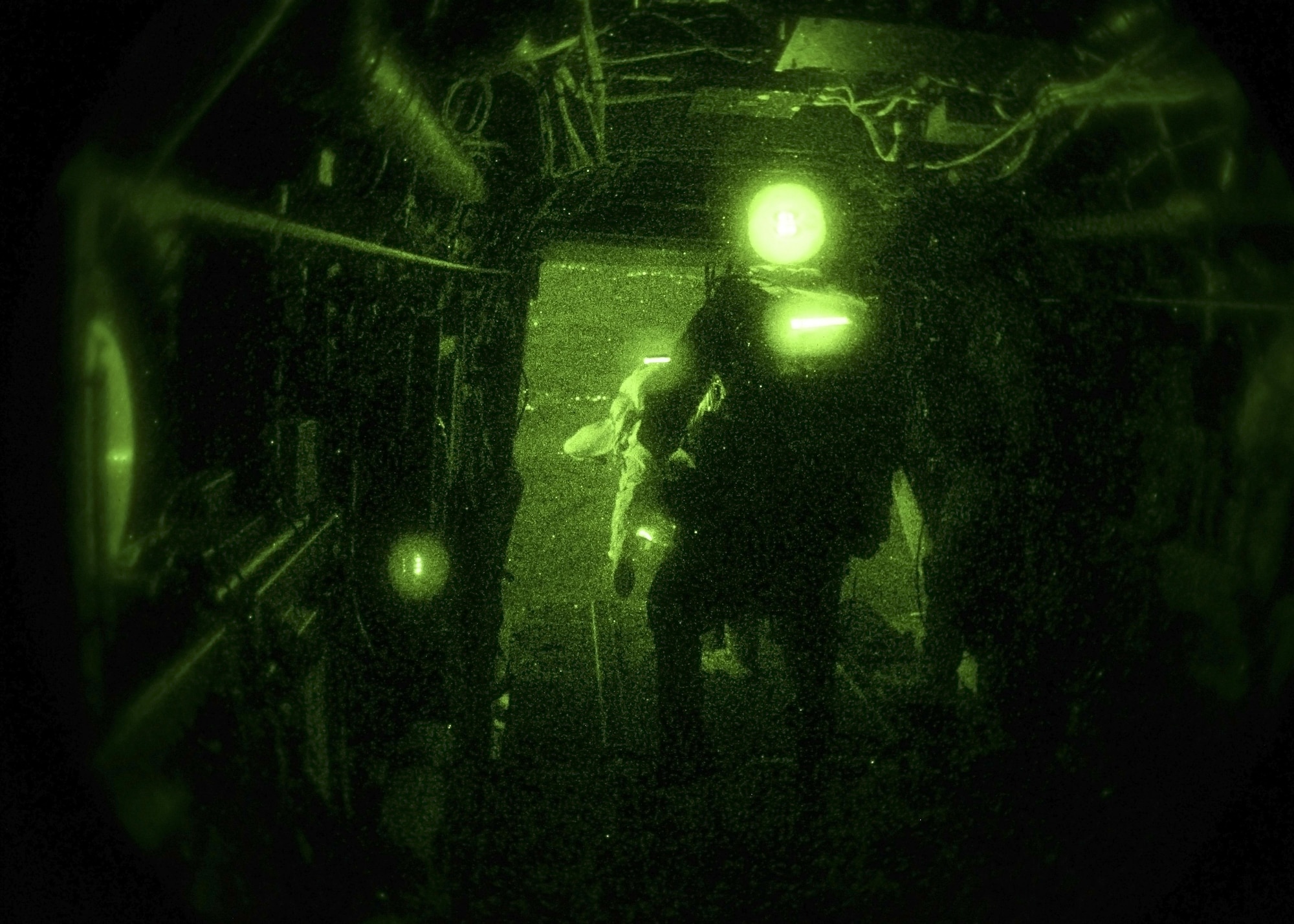 Air Commandos from the 321st Special Tactics Squadron perform a high altitude, low opening Military Free Fall jump using Night Vision Goggles Dec. 14, 2016, over a drop zone located in Sculthorpe, England.  The jump was performed in order to certify the jumpmaster with the use of Night Vision Goggles, which is an advance-level skill. (U.S. Air Force photo by Staff Sgt. Victoria H. Taylor)