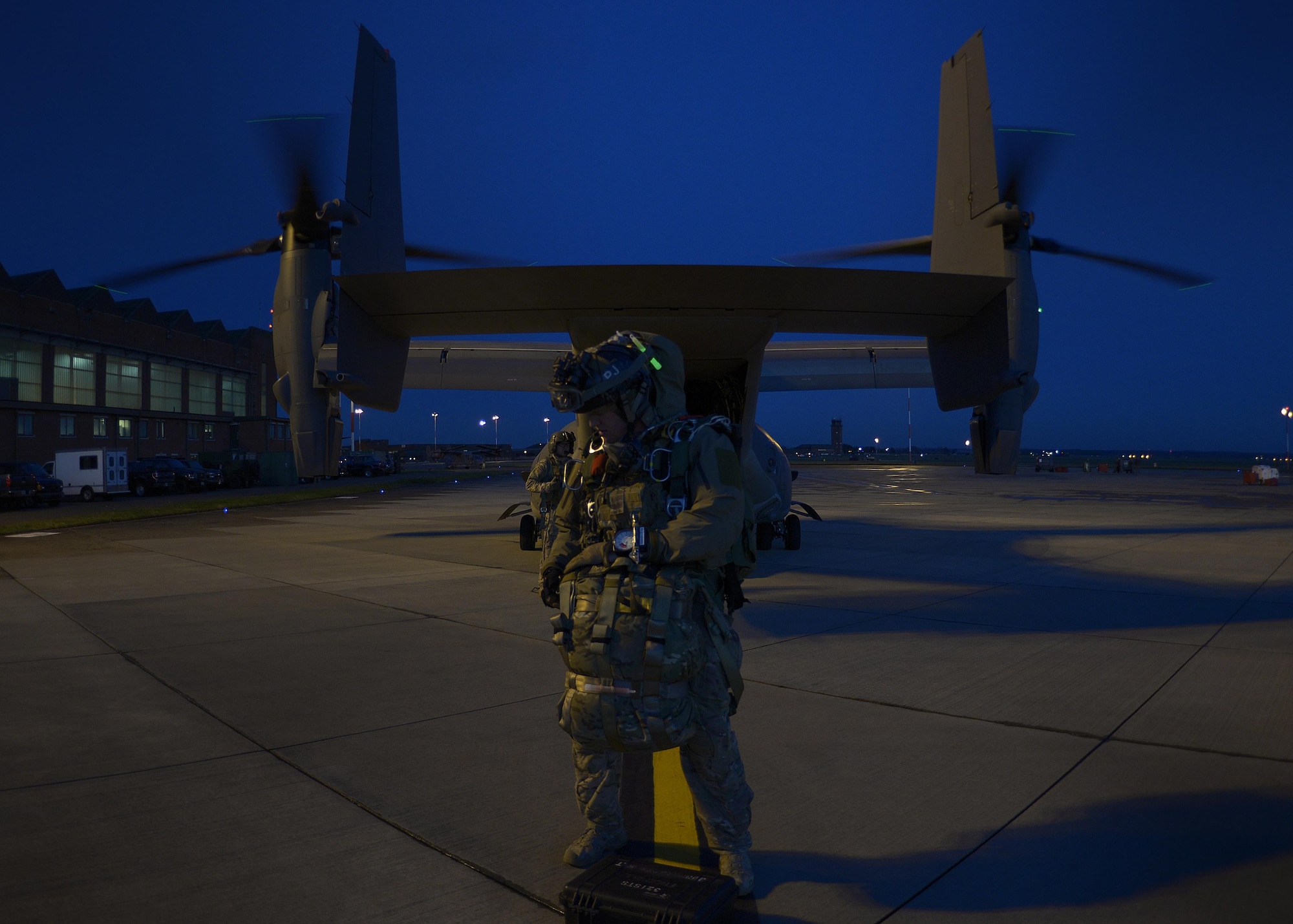 An Air Commando from the 321st Special Tactics Squadron prepares to board a CV-22 Osprey Dec. 14, 2016, on RAF Mildenhall, England. The Osprey is a multi-mission, tiltrotor aircraft with both vertical takeoff and landing, and short takeoff and landing capabilities. (U.S. Air Force photo by Staff Sgt. Victoria H. Taylor)