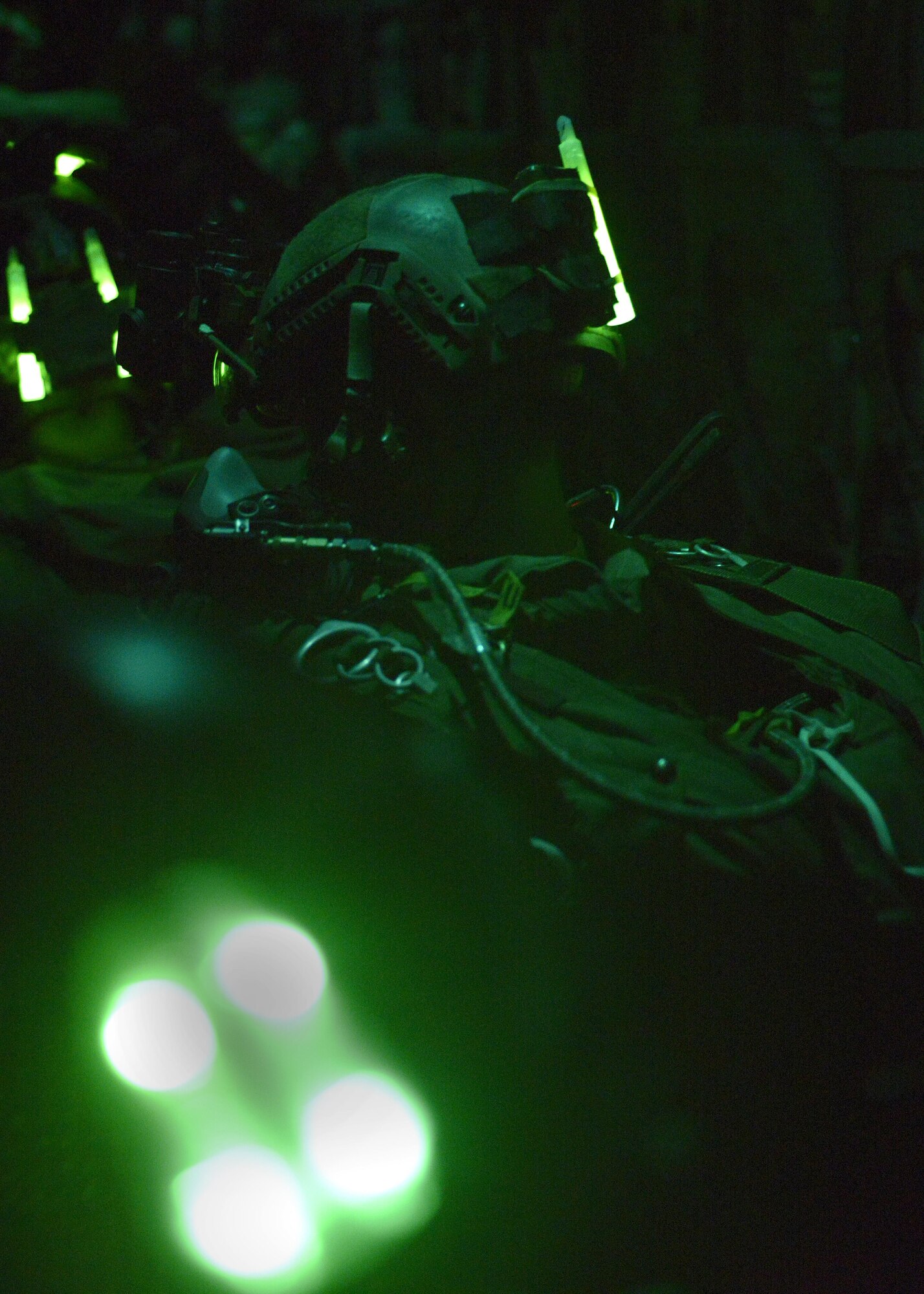 An Air Commando from the 321st Special Tactics Squadron prepares to perform a high altitude, low opening Military Free Fall jump using Night Vision Goggles Dec. 14, 2016, over a drop zone located in Sculthorpe, England. The jump was performed in order to certify the jumpmaster with the use of Night Vision Goggles, which is an advance-level skill. (U.S. Air Force photo by Staff Sgt. Victoria H. Taylor)