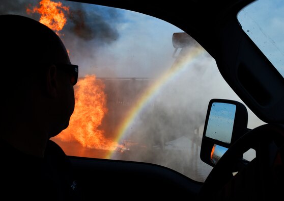 A firefighter uses a rapid intervention vehicle to respond to an aircraft fire during training Dec. 7, 2016, at Luke Air Force Base, Ariz. This training was performed by firefighters from the 56th Civil Engineer Squadron and the Gila Bend Fire Department. (U.S. Air Force photo/Senior Airman James Hensley)