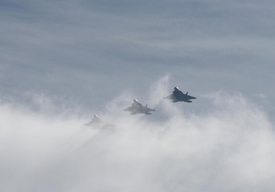 Three F-22 Raptors from Tyndall Air Force Base, Fla., fly in formation during Checkered Flag 17-1 on Dec. 8, 2016. The integration training pilots receive during exercises like Checkered Flag ensure they can seamlessly work together in a real-world combat situation. (U.S. Air Force photo/Staff Sgt. Alex Fox Echols III)