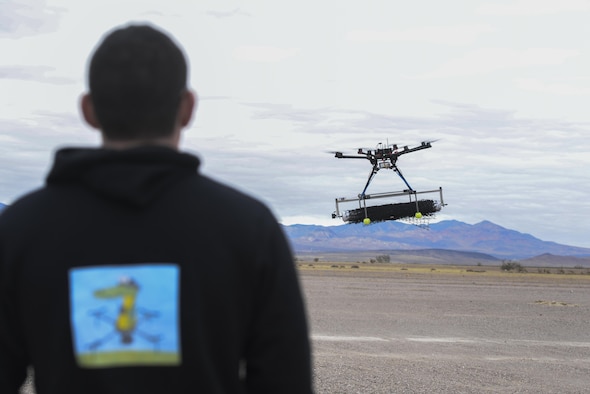 Second Lt. David Feibus, from Wright-Patterson Air Force Base, Ohio, fly's one his teams DJI S1000 drones during the setup and calibration phase of an event at the Nevada National Security Site in Las Vegas Dec. 9, 2016. This year teams were given the challenge of solving issues revolving around drones, and demonstrated their solutions to judges. (U.S. Air Force photo/Wesley Farnsworth)