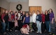 Former Heisman Trophy winner Herschel Walker takes a moment to pose with members of the Kirtland Spouses' Club during his visit to Kirtland Dec. 12-13.  Walker spoke at multiple venues on base, detailing his struggles with mental illness and encouraging those with issues to seek help.  