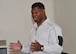 Former pro football player Herschel Walker speaks Team Kirtland members during his visit to the base Dec. 12-13. Walker came to the base to tell Airmen about his suffering with a mental illness. He said there is no shame in asking for help.
