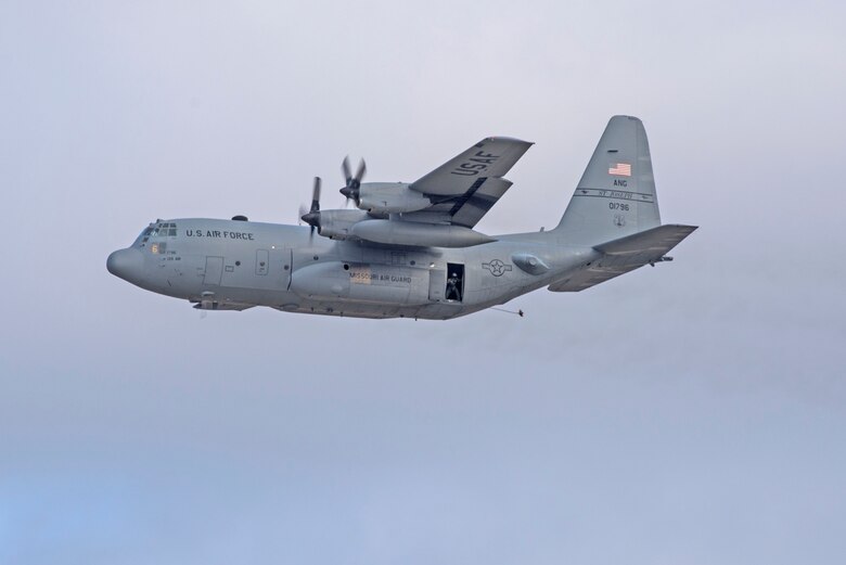 In a first for the 375th Air Mobility Wing and the next step in certifying a new Drop Zone area for use on Scott’s flight line, a C-130 performs a test air drop Dec. 13, 2016, Scott Air Force Base, Ill. The 375th Operational Support Squadron created the Drop Zone to increase the readiness of units in and around Scott and for use by flying or ground units with an interest and the requirement. This new capability opens up a multitude of functions that the airfield can provide, making Scott a desired destination for aviators and jumpers. The C-130 was from the 180th Airlift Squadron, Air National Guard, St. Joseph, Mo.