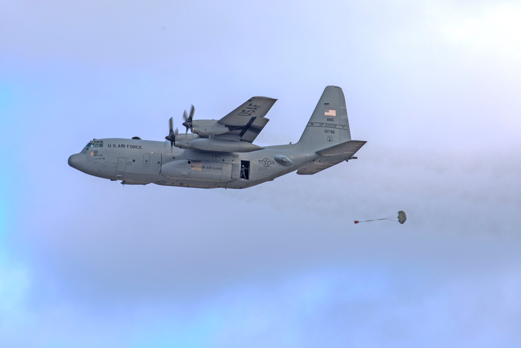 In a first for the 375th Air Mobility Wing and the next step in certifying a new Drop Zone area for use on Scott’s flight line, a C-130 performs a test air drop Dec. 13, 2016, Scott Air Force Base, Ill. The 375th Operational Support Squadron created the Drop Zone to increase the readiness of units in and around Scott and for use by flying or ground units with an interest and the requirement. This new capability opens up a multitude of functions that the airfield can provide, making Scott a desired destination for aviators and jumpers. The C-130 was from the 180th Airlift Squadron, Air National Guard, St. Joseph, Mo.