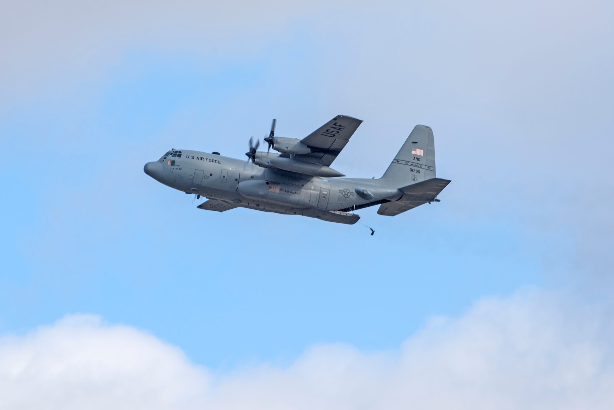 In a first for the 375th Air Mobility Wing and the next step in certifying a new Drop Zone area for use on Scott’s flight line, a C-130 performs a test air drop Dec. 13, 2016, Scott Air Force Base, Ill. The 375th Operational Support Squadron created the Drop Zone to increase the readiness of units in and around Scott and for use by flying or ground units with an interest and the requirement. This new capability opens up a multitude of functions that the airfield can provide, making Scott a desired destination for aviators and jumpers. The C-130 was from the 180th Airlift Squadron, Air National Guard, St. Joseph, Mo.