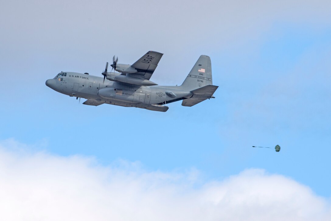 In a first for the 375th Air Mobility Wing and the next step in certifying a new Drop Zone area for use on Scott’s flight line, a C-130 performs a test air drop Dec. 13, 2016, Scott Air Force Base, Ill. The 375th Operational Support Squadron created the Drop Zone to increase the readiness of units in and around Scott and for use by flying or ground units with an interest and the requirement. This new capability opens up a multitude of functions that the airfield can provide, making Scott a desired destination for aviators and jumpers. The C-130 was from the 180th Airlift Squadron, Air National Guard, St. Joseph, Mo.