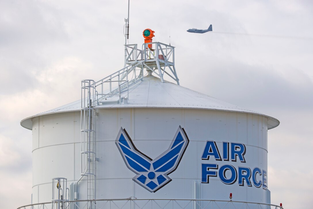 In a first for the 375th Air Mobility Wing and the next step in certifying a new Drop Zone area for use on Scott’s flight line, a C-130 performs a test air drop Dec. 13, 2016, Scott Air Force Base, Ill. The 375th Operational Support Squadron created the Drop Zone to increase the readiness of units in and around Scott and for use by flying or ground units with an interest and the requirement. This new capability opens up a multitude of functions that the airfield can provide, making Scott a desired destination for aviators and jumpers. The C-130 was from the 180th Airlift Squadron, Air National Guard, St. Joseph, Mo.