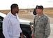 Former Heisman Trophy winner Herschel Walker chats with Lt. Col. James Meier, 377th Weapons System Security Squadron commander, during his visit to Kirtland Dec. 12-13.  Walker spoke at multiple venues, detailing his struggles with mental illness and encouraging those with issues to seek help.  