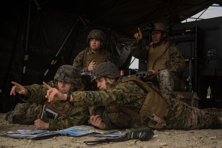 Marines point to positions where they want a virtual target to be in order to call for mortar fire at Marine Corps Base Camp Lejeune, N.C., Dec. 13, 2016. The virtual targets are part of the Augmented Immersive Team Trainer which can position a target anywhere. Having the capability of replacing actual targets with virtual targets allows Marines the ability to conduct training more efficiently without having to stop to rebuild targets. The Marines are with 2nd Battalion, 10th Marine Regiment, 2nd Marine Division.