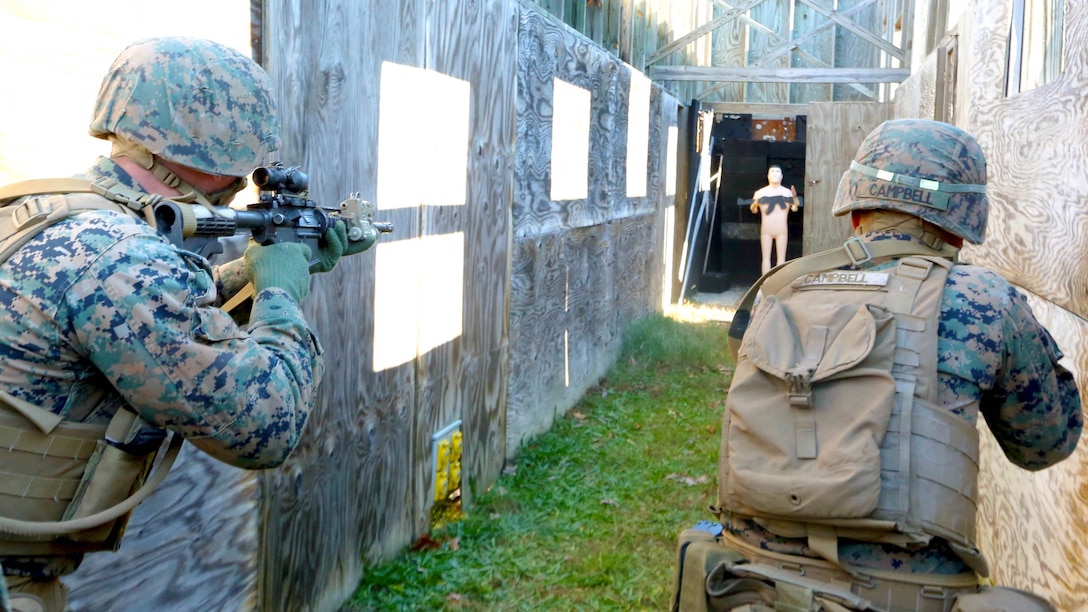 Pfc. Michael R. Campbell (right) and Pfc. Joseph A. Glance II (left) perform clearing operations through the Urban Assault Course during a deployment for training exercise at Fort Pickett, Va., Dec. 2, 2016. The Marines enhanced their skills as infantrymen while conducting the UAC training. Campbell and Glance are motormen with Weapons Company, 3rd Battalion, 8th Marine Regiment. 