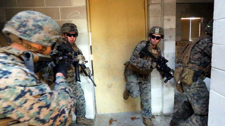 Marines practice clearing rooms in the Urban Assault Course during a deployment for training exercise at Fort Pickett, Va., Dec. 2, 2016. The course strengthened their ability to operate from buddy pairs up to squads, while maintaining communication at all levels. The Marines are with Weapons Company, 3rd Battalion, 8th Marine Regiment. 