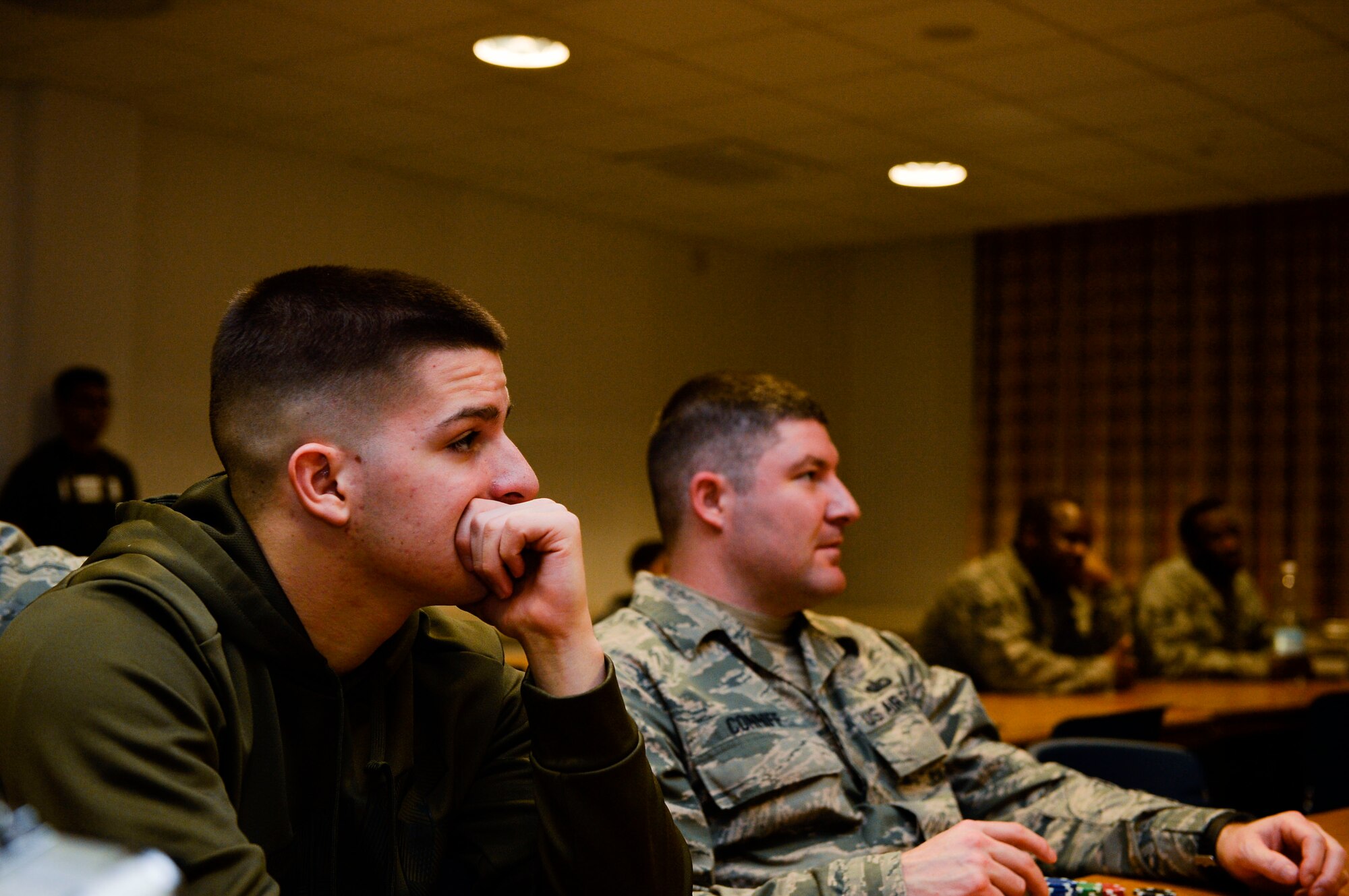 Airmen listen to a talk given by an NCO during a Huddle meeting at Ramstein Air Base, Germany, Dec. 13, 2016. The Huddle is a club which aims to provide mentorship opportunities to young Airman and encourages open dialogue between the junior enlisted and senior NCO corps. (U.S. Air Force photo by Airman 1st Class Joshua Magbanua)