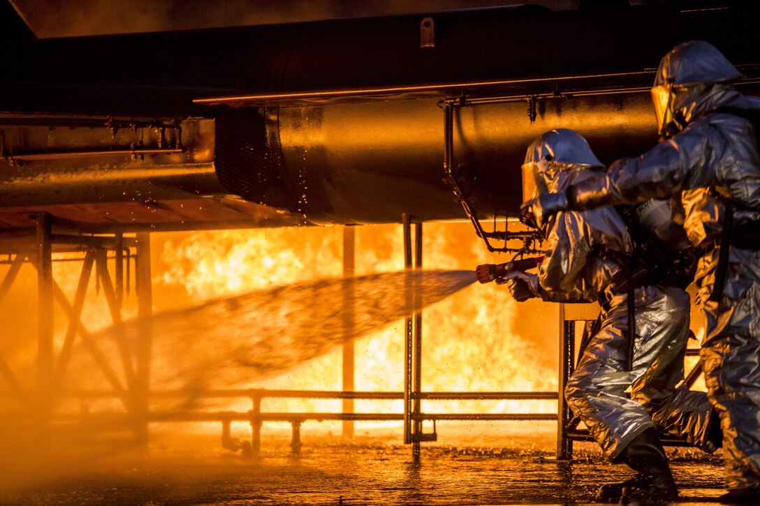 Marines put out a jet fuel fire during a training exercise at Marine Corps Air Station Beaufort S.C., Dec. 13, 2016. The Marines with Expeditionary Firefighting Rescue conducted the training to prepare for and hone skills necessary to face real life scenarios. The training also served as an opportunity to strengthen camaraderie and enhance trust among the unit members. The Marines are with EFR, Headquarters and Headquarters Squadron.