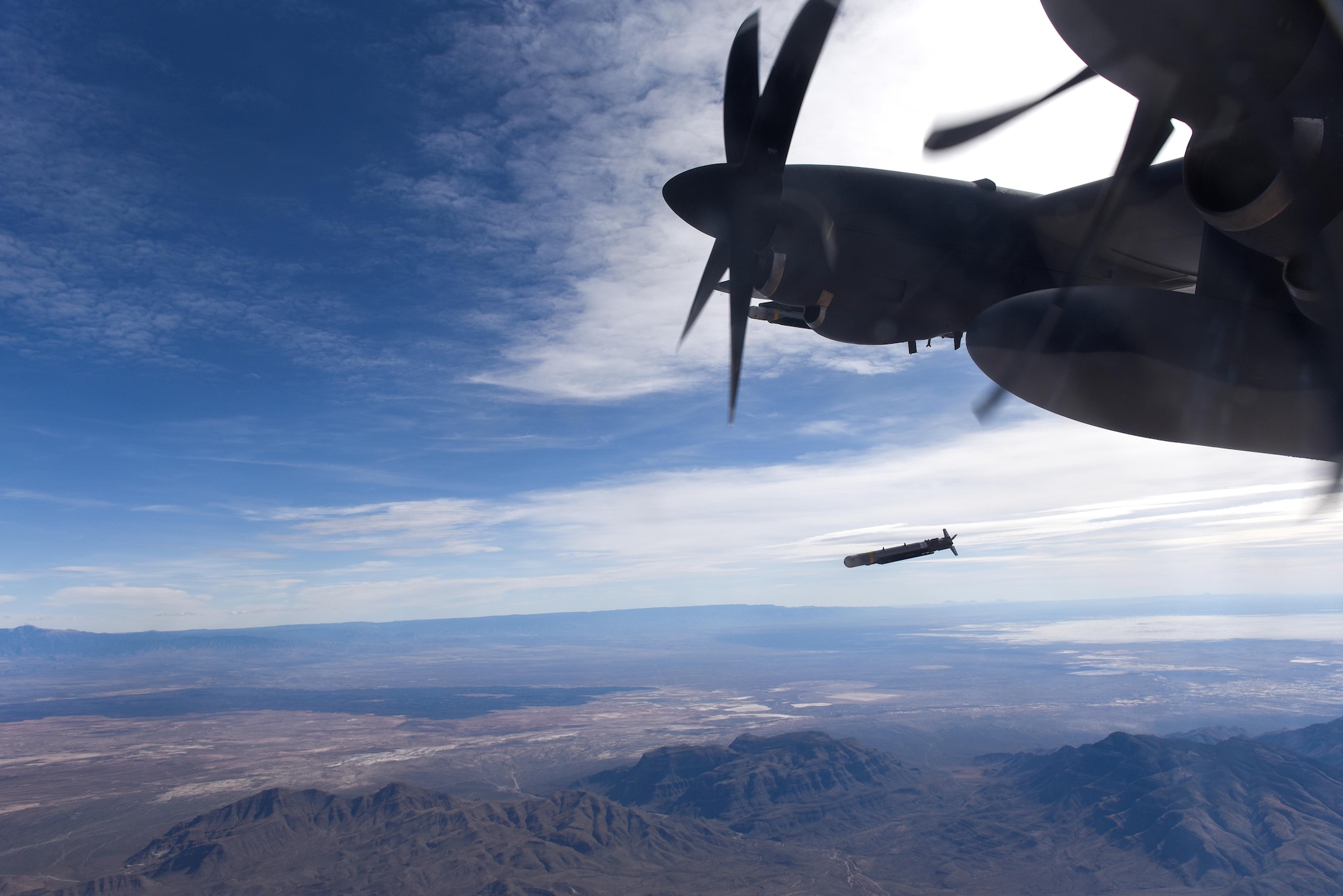A Laser Guided Small Diameter Bomb is released from the wing of an AC-130J Ghostrider over White Sands Missile Range, N.M., Dec. 13, 2016. The AC-130J is outfitted with multiple weapons systems to include a 30mm and 105mm cannon, GBU-39 Small Diameter Bombs and AGM-176 Griffin missiles. (U.S. Air Force photo by Senior Airman Jeff Parkinson)