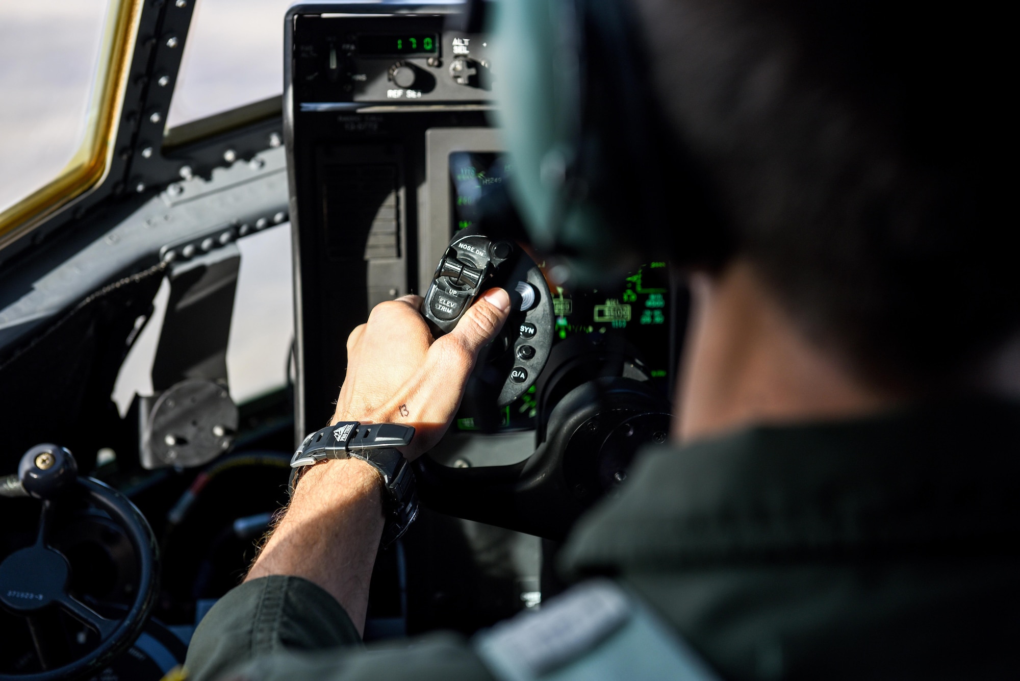 Maj. Brian Pesta, a pilot with the 1st Special Operations Group, Detachment 2, pilots an AC-130J Ghostrider with the number 13 written on his hand during a training mission over White Sands Missile Range, N.M., Dec. 13, 2016. Pesta writes down the number of crew on his hand before each flight for quick reference in the event of an emergency. (U.S. Air Force photo by Senior Airman Jeff Parkinson)