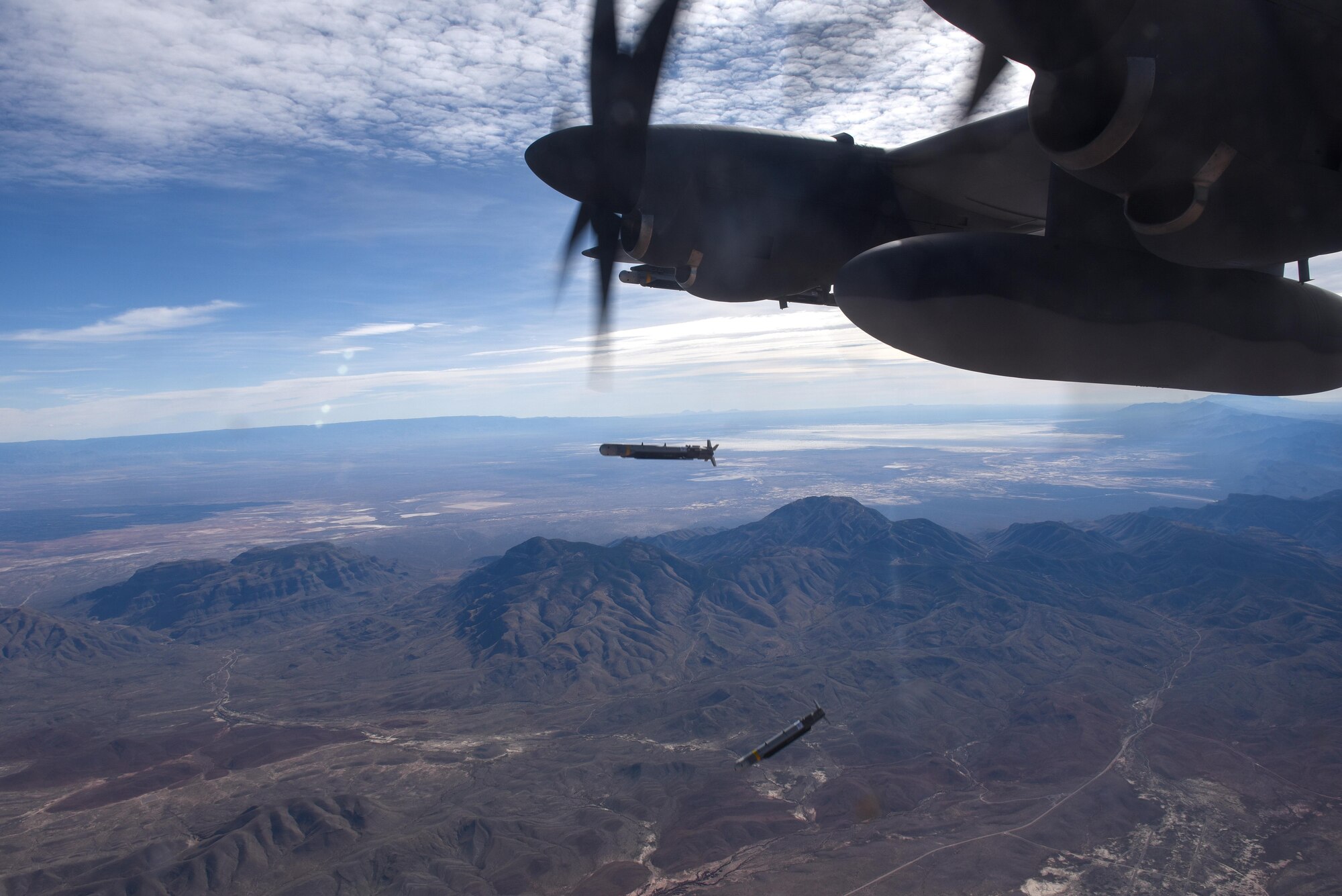 Two, Laser Guided Small Diameter Bombs are released from the wing of an AC-130J Ghostrider over White Sands Missile Range, N.M., Dec. 13, 2016. The AC-130J is outfitted with multiple weapons systems to include a 30mm and 105mm cannon, GBU-39 Small Diameter Bombs and AGM-176 Griffin missiles. (U.S. Air Force photo by Senior Airman Jeff Parkinson)