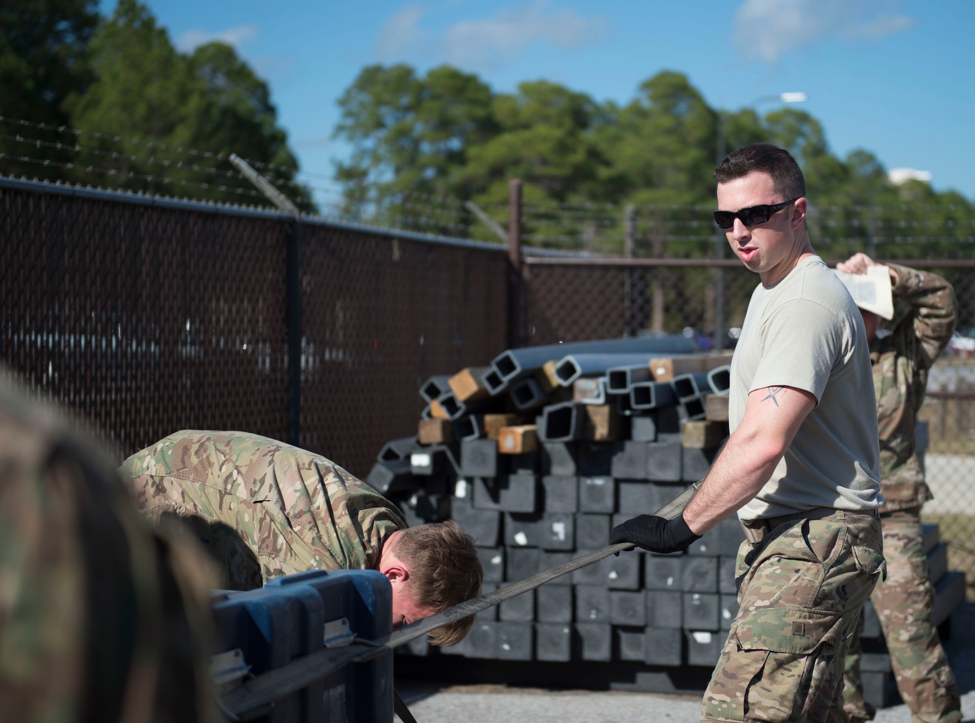 Staff Sgt. Jerred Brown, an aircrew flight equipment craftsman with the 34th Special Operations Squadron, straps down cargo during pallet build-up training at Hurlburt Field, Fla., Dec. 12, 2016. AFE Air Commandos were trained how to properly document and load cargo onto aircraft, ensuring readiness to execute global special operations. (U.S. Air Force photo by Senior Airman Krystal M. Garrett)