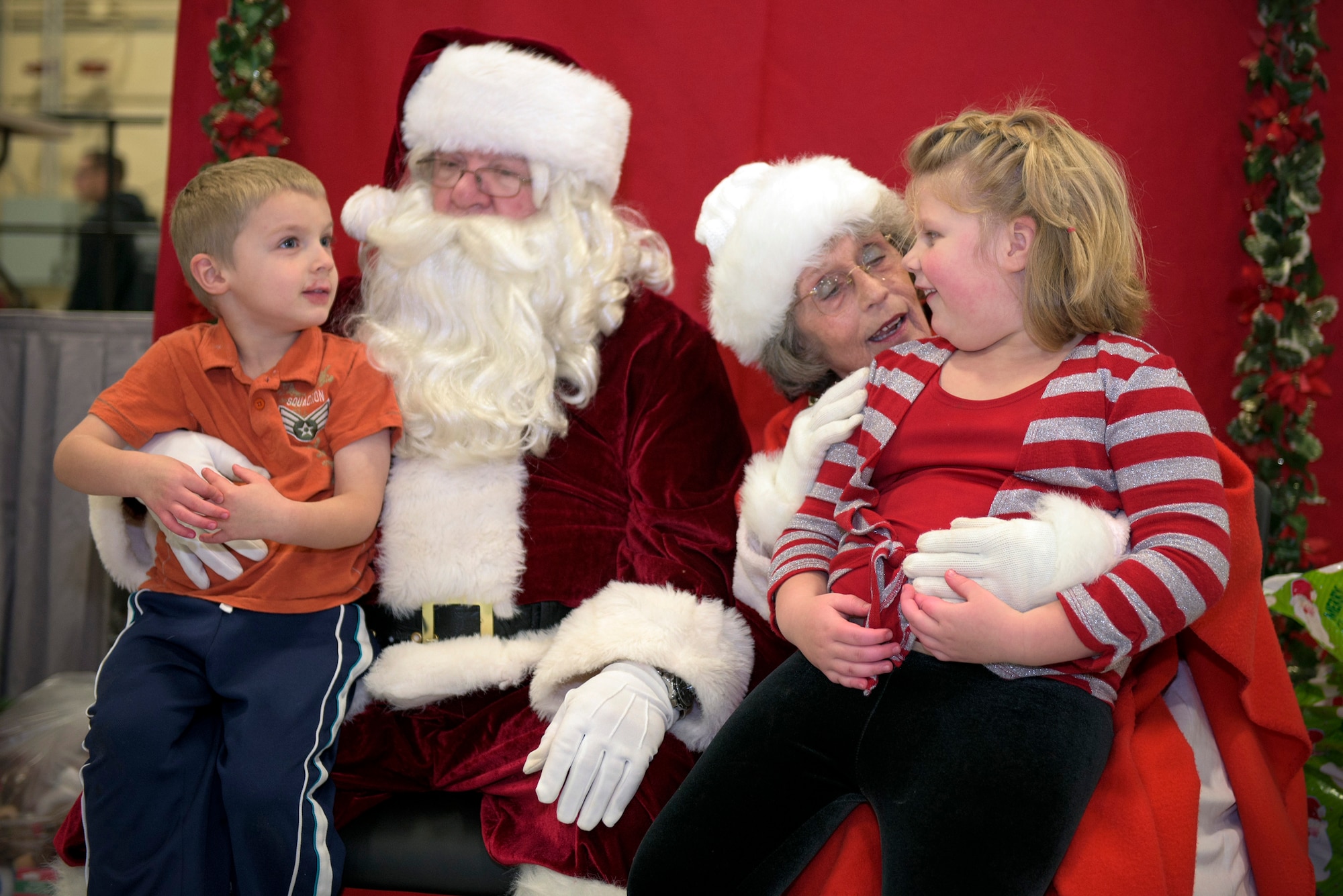 The children of U.S. Air Force Staff Sgt. Sarah Kaiser, an instrumentalist with the 566th Air Force Band, Illinois Air National Guard, visit with Santa and Mrs. Claus at the 182nd Airlift Wing’s annual holiday party Dec. 3 in Peoria, Ill. The wing held the event to provide ANG families an opportunity to celebrate with their fellow unit members. (U.S. Air National Guard photo by Tech. Sgt. Lealan Buehrer)